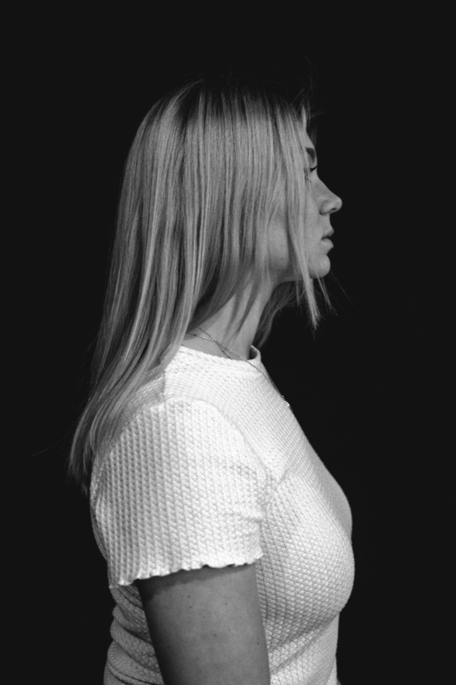 Black-and-white profile portrait of Ingrid S.